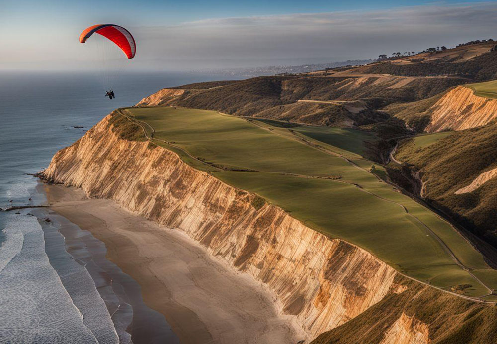 A person paragliding over a cliff